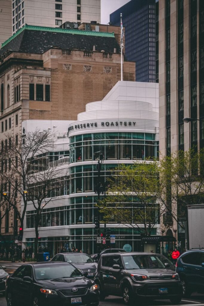 best coffee shops in chicago Urban scene of Chicago's Starbucks Reserve Roastery amidst city traffic.